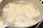 Dry Hong Kong style noodles by Rabbit Brand, 500g package, thin wheat noodles for stir-fries and soups.