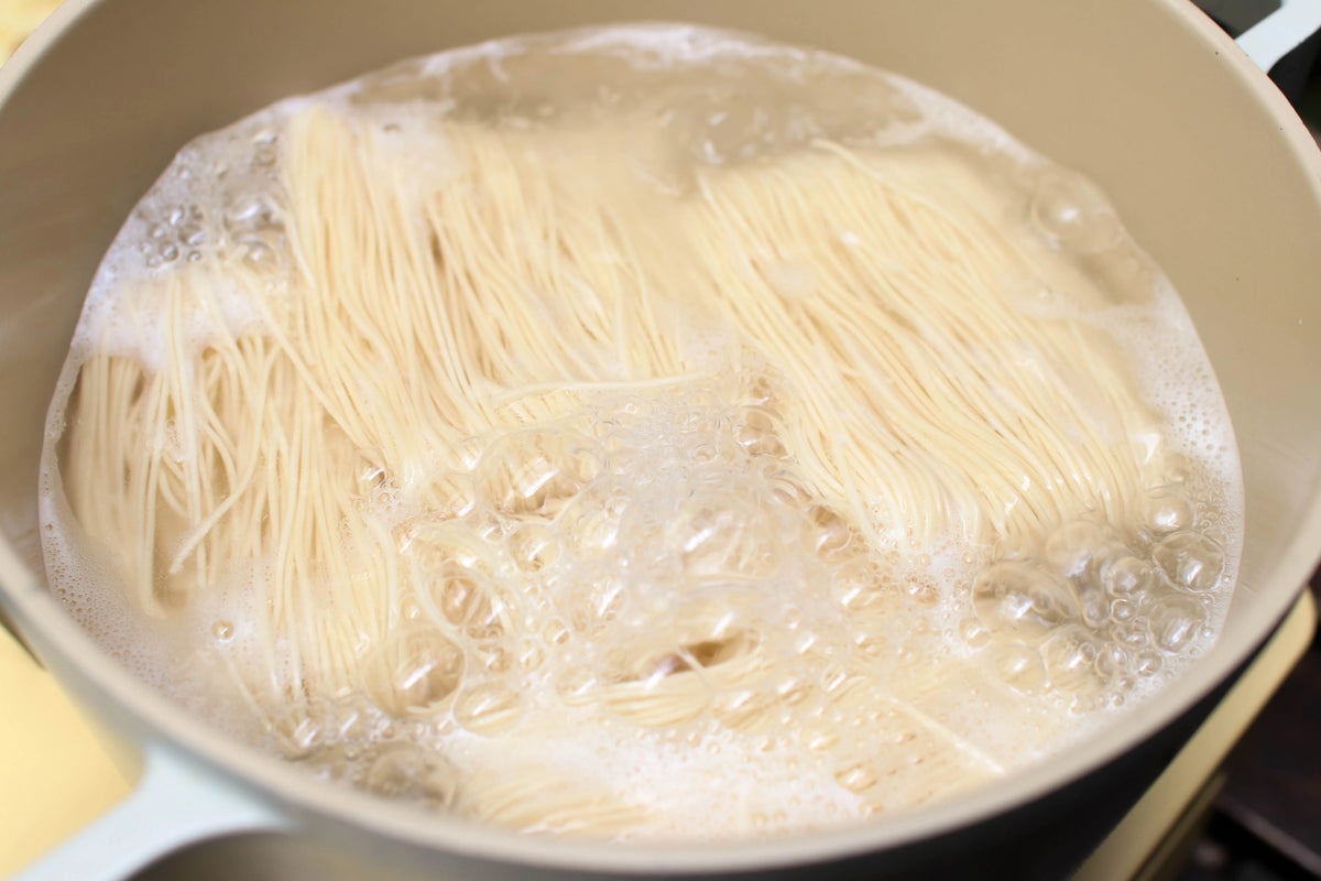 Dry Hong Kong style noodles by Rabbit Brand, 500g package, thin wheat noodles for stir-fries and soups.