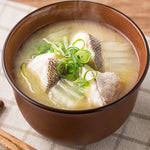Marukome Shiro Miso white soybean paste in a jar, traditional Japanese dry grocery product for cooking and recipes.