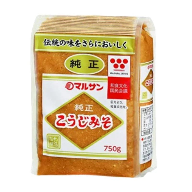Marusan-ai Jyunsei Koji Miso made with soybeans, dry grocery product, in a jar with a label, close-up of the miso paste.