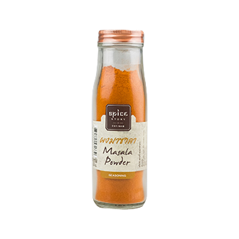 Spice Story Masala Powder in a jar, showcasing vibrant, mixed spices used for flavorful cooking and seasoning.