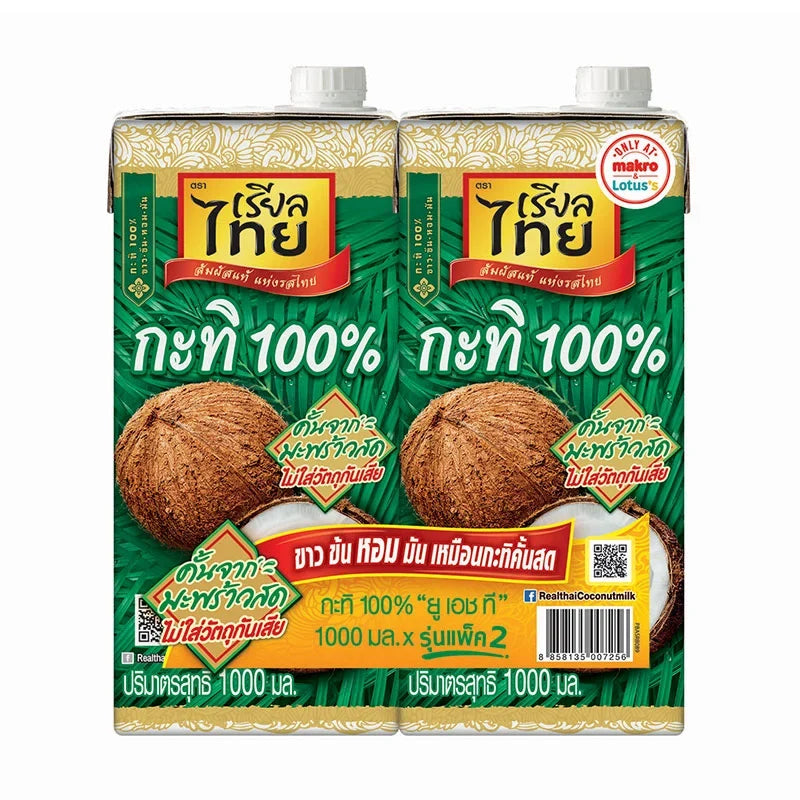 Two 1-liter cartons of REAL THAI coconut milk, UHT dry grocery product, with white packaging and label visible.