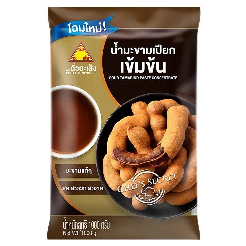 Chua Hah Seng Sour Tamarind Paste Concentrate 1kg in a plastic jar, ready for cooking or seasoning in dry grocery kitchen use.