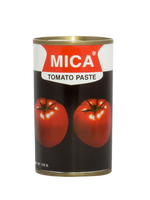 Mica Tomato Paste jar from grocery aisle, smooth red paste in a clear glass container with a yellow lid, suitable for cooking.