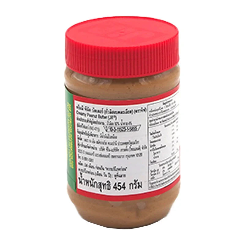 Creamy JIF Peanut Butter jar with 454g label, shown in a grocery setting, highlighting the smooth, creamy texture.