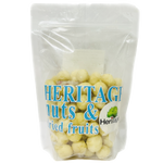 Heritage Raw Macadamia nuts in natural, unroasted form, showcasing their creamy, textured kernels in a close-up image.