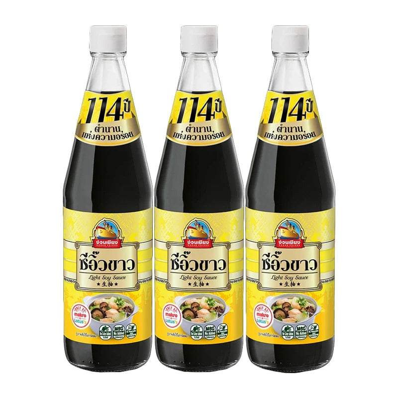 Nguan Chiang Light Soy Sauce 700ml bottles, clear glass with white caps, arranged in a row for dry grocery shopping.