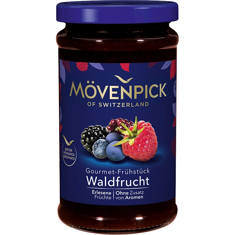 Movenpick Gourmet Breakfast with forest berries in a bowl, featuring fresh berries and creamy yogurt on a wooden table.