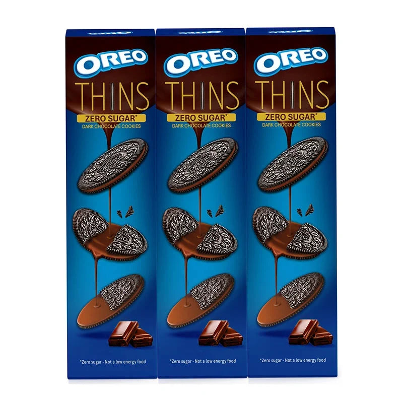 OREO Cookies Thins Zero Sugar Dark Chocolate snack pack with three 62g boxes, featuring thin, dark chocolate-flavored cookies.