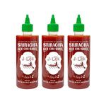 J-lek Sriracha Chili Sauce bottle showing spicy red chili sauce in a 455ml container, used for adding heat to dishes.