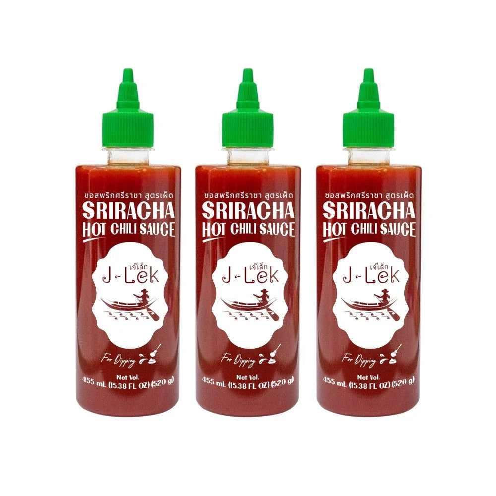 J-lek Sriracha Chili Sauce bottle showing spicy red chili sauce in a 455ml container, used for adding heat to dishes.