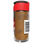 Ground ginger spice in a McCormick branded jar, showing the label and spice inside on a grocery store shelf.
