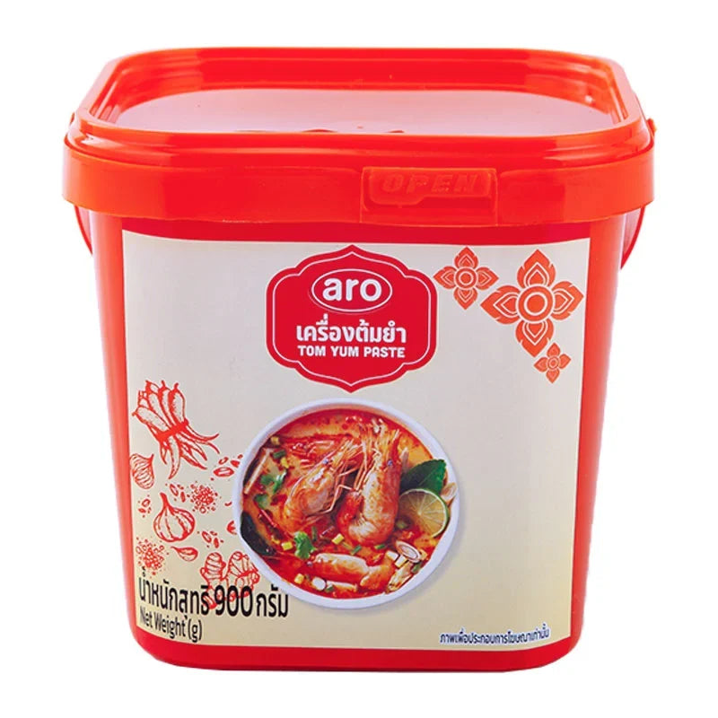 ARO Tom Yum Paste in 900g jar, a Thai dry grocery product with vibrant red chili and aromatic herbs visible in the image.