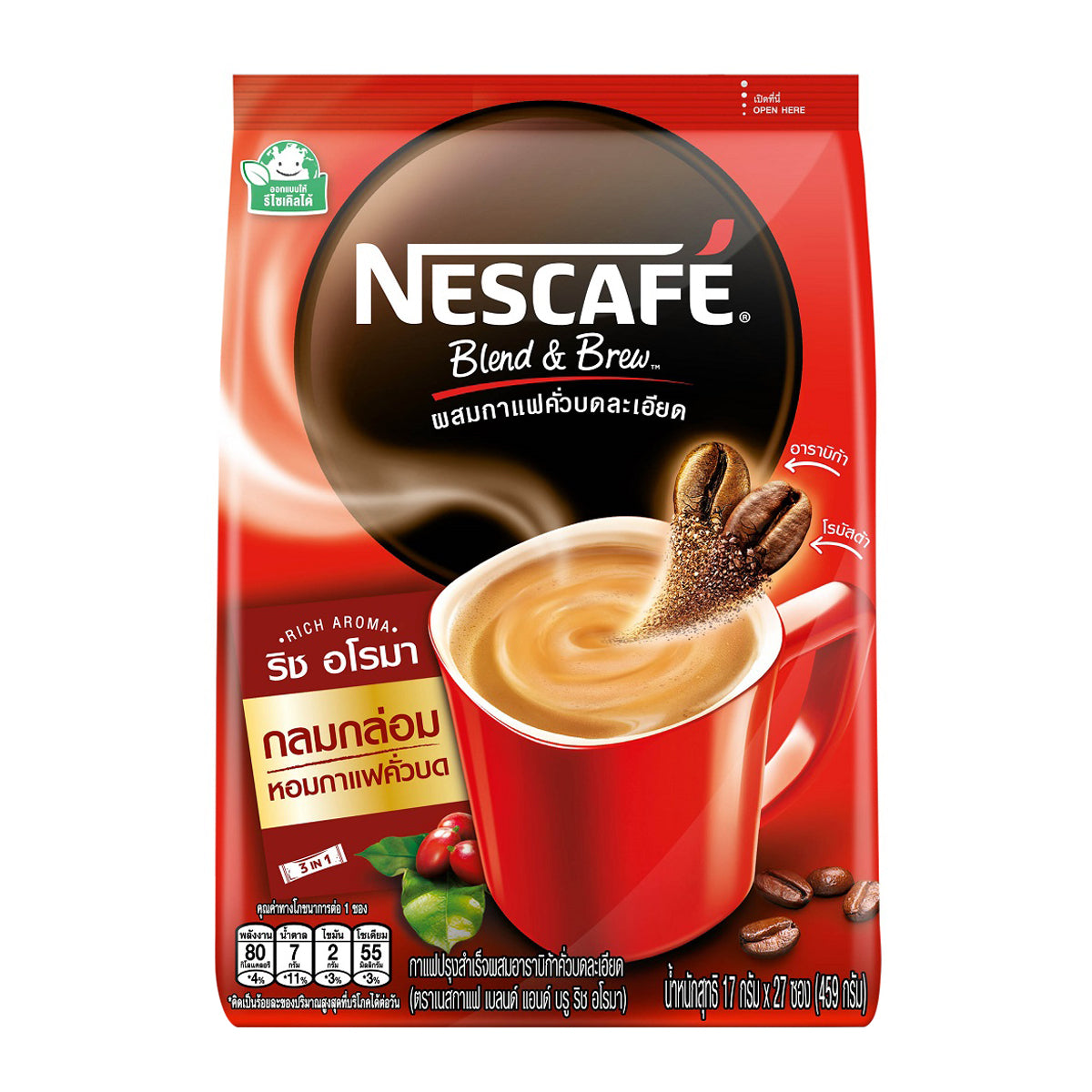 Nescafe Blend and Brew instant coffee mix in a jar, showcasing rich aroma and a scoop of coffee powder on a wooden surface.