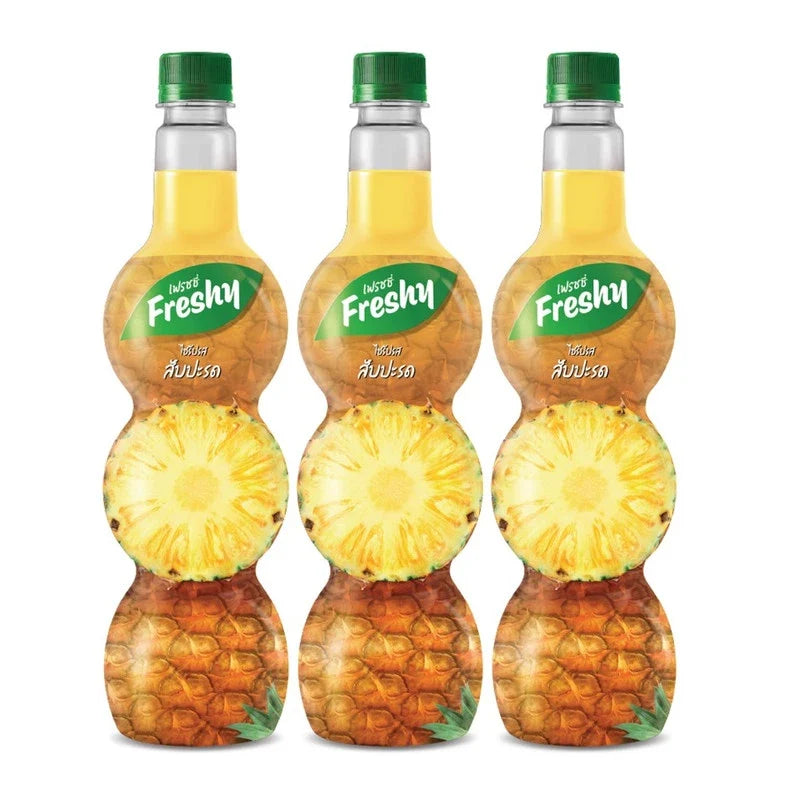Freshy Pineapple Flavored Syrup 710ml, three bottles of dry grocery product with vibrant yellow pineapple flavor label.
