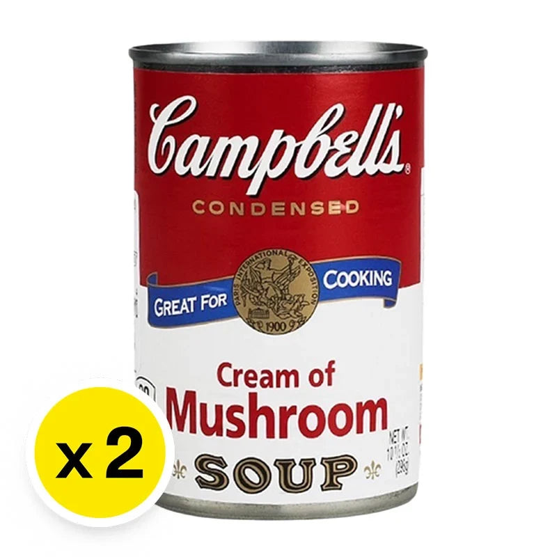 CAMPBELL'S Mushroom Cream Soup in 298g cans, stacked in a grocery setting, ready for cooking or meal preparation