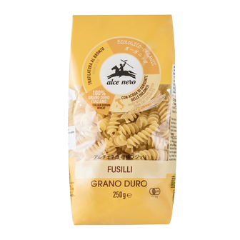 Alce Nero Organic Fusilli pasta in a bowl, showcasing the corkscrew-shaped gluten-free pasta in a grocery product image