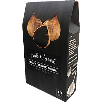 Grab N' Good Black Diamond Garlic confectionery snack, showing dark chocolate-coated garlic pieces in a close-up image.