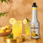 MONIN Yuzu Fruitmix 1000ml bottle for dry grocery, featuring bright yellow Yuzu citrus fruit and label on the container.