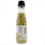 Tid Too Green Seafood Sauce bottle from the grocery store, featuring green-colored sauce and brand label.