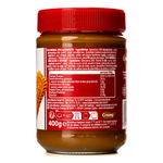 Jar of Lotus Biscoff Creamy Spread with smooth caramel-colored texture, ideal for spreading on bread or toast.