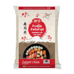 Bag of ARO Japanese rice, 5kg, dry grocery product, showing white rice grains in a clear plastic bag.