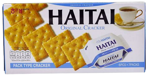 Hai Tai Ace Cracker confectionery snack, golden crispy cracker with textured surface, shown in close-up.