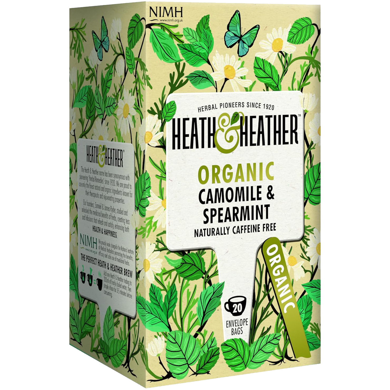Heath & Heather Organic Camomile and Spearmint Tea in a glass cup with fresh herbs on a wooden table.