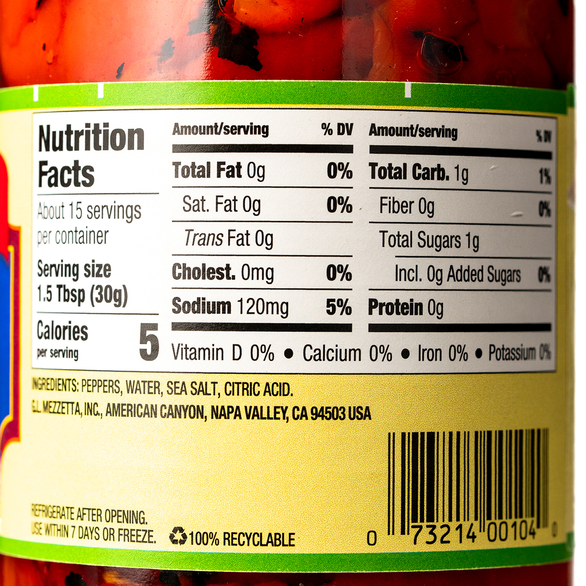 Jar of Mezzetta roasted bell peppers in a glass jar, showcasing vibrant red and yellow peppers ready for cooking or snacking.