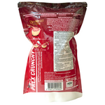 Diamond Grains Red Velvet Granola in a clear bowl, showing crunchy granola clusters with red velvet flavor and vibrant red color.