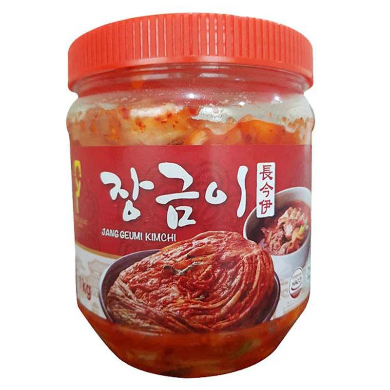 Dry grocery Jang Geumi Kimchi 1kg jar, showing the traditional Korean fermented cabbage and vegetable kimchi in a clear container.