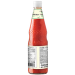 Deksomboon Keto Sukiyaki Sauce bottle, clear label with red cap, shown on a grocery store shelf with other Asian sauces.