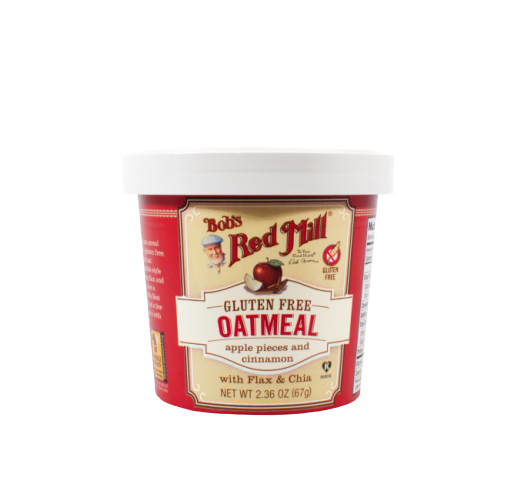 Bob's Red Mill gluten-free oatmeal with apple pieces and chia seeds in a bowl, ready for breakfast.