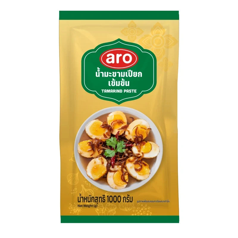 Aro Tamarind Paste 1kg in a clear container, showcasing the dark, thick paste used in cooking and flavoring dishes.
