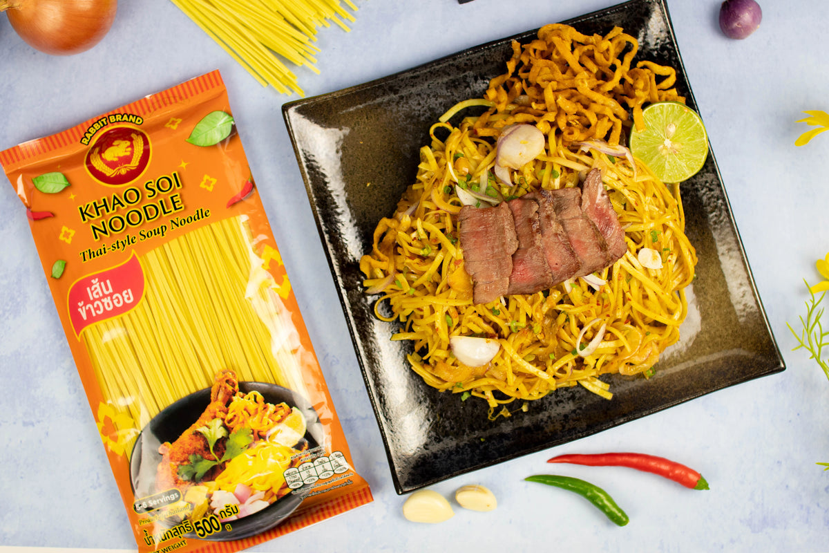 Dry grocery image of Rabbit Brand Khao SOI Noodles 500g, dried rice noodles in a clear package with branding visible.