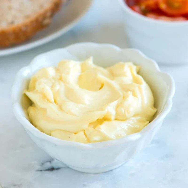 Remia Mayo Light Vegan 500ml jar showing smooth, creamy vegan mayonnaise in a clear jar with a white lid.