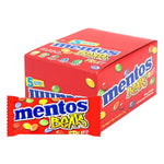 Mentos Candy 14g packs, showing colorful chewy mints in individual wrappers, arranged in a display.