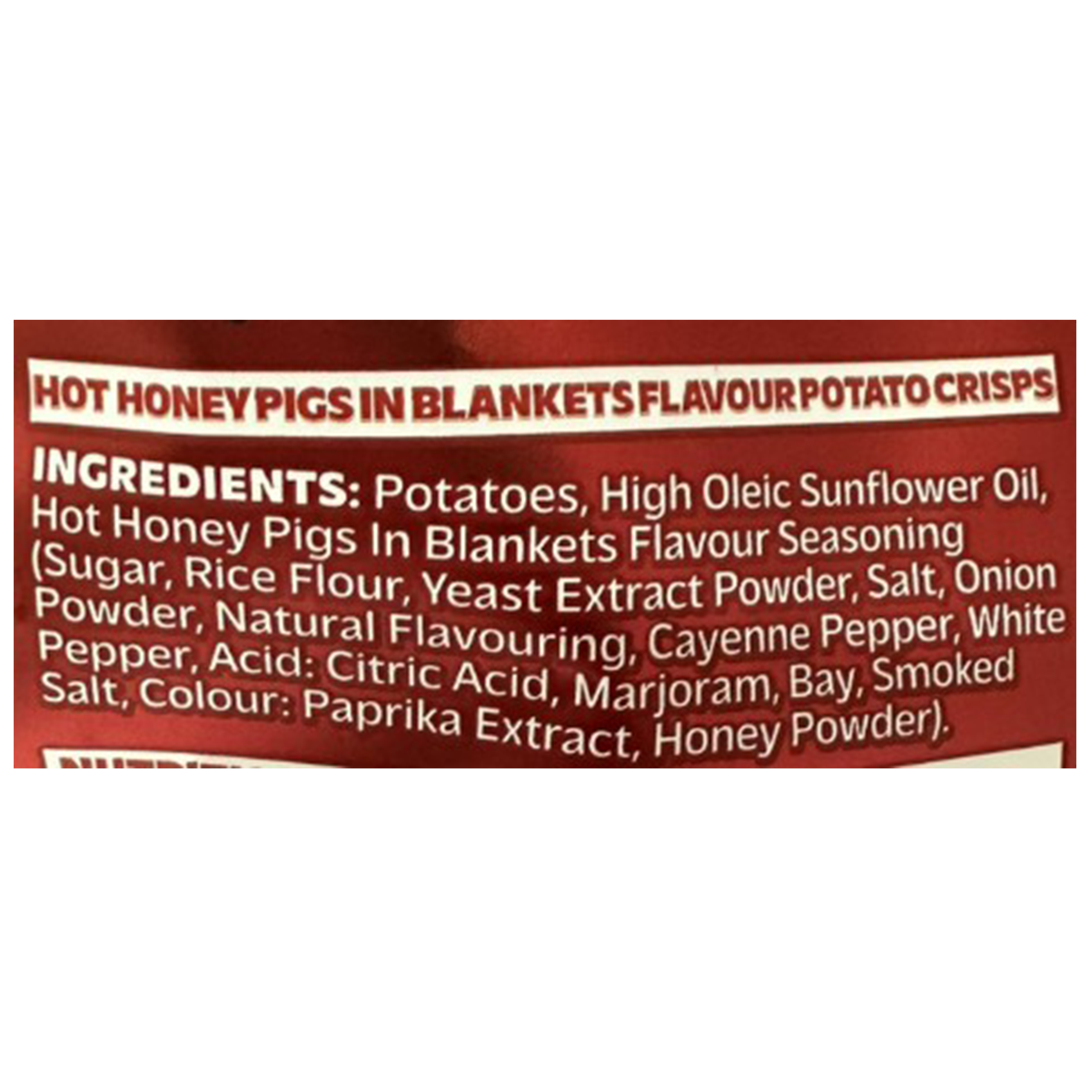 Taylors Hot Honey Pigs in Blankets crisps, savory confectionery snacks with a spicy honey flavor, shown in a close-up image.