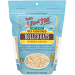 Organic rolled oats from Bob's Red Mill in a clear resealable bag, showing light brown oats ready for cooking or baking.
