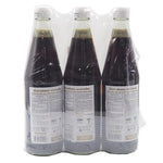 Three bottles of Nguan Chiang Mushroom Sauce, 700g each, in clear glass bottles with labels, suitable for dry grocery shopping.