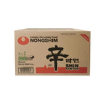 Nongshim Shin Ramyun dry noodle soup with spicy broth and dried vegetable toppings, packaged in a black and red instant noodle cup.