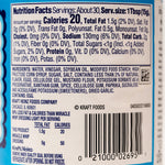 Jar of Kraft Miracle Whip Light Mayonnaise with a white label and red cap, placed on a grocery store shelf.
