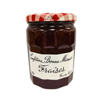 Jar of Bonne Maman Strawberry Jam 750g with a classic label, featuring fresh strawberries and a red lid, on a grocery shelf.