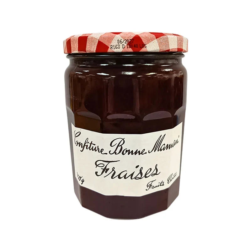 Jar of Bonne Maman Strawberry Jam 750g with a classic label, featuring fresh strawberries and a red lid, on a grocery shelf.