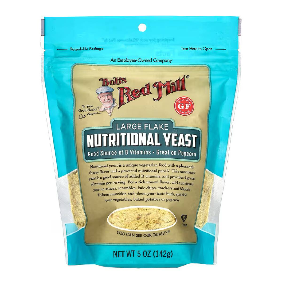 Bob's Red Mill Nutritional Yeast in a clear container, showing yellow flaky nutritional yeast for cooking and seasoning.