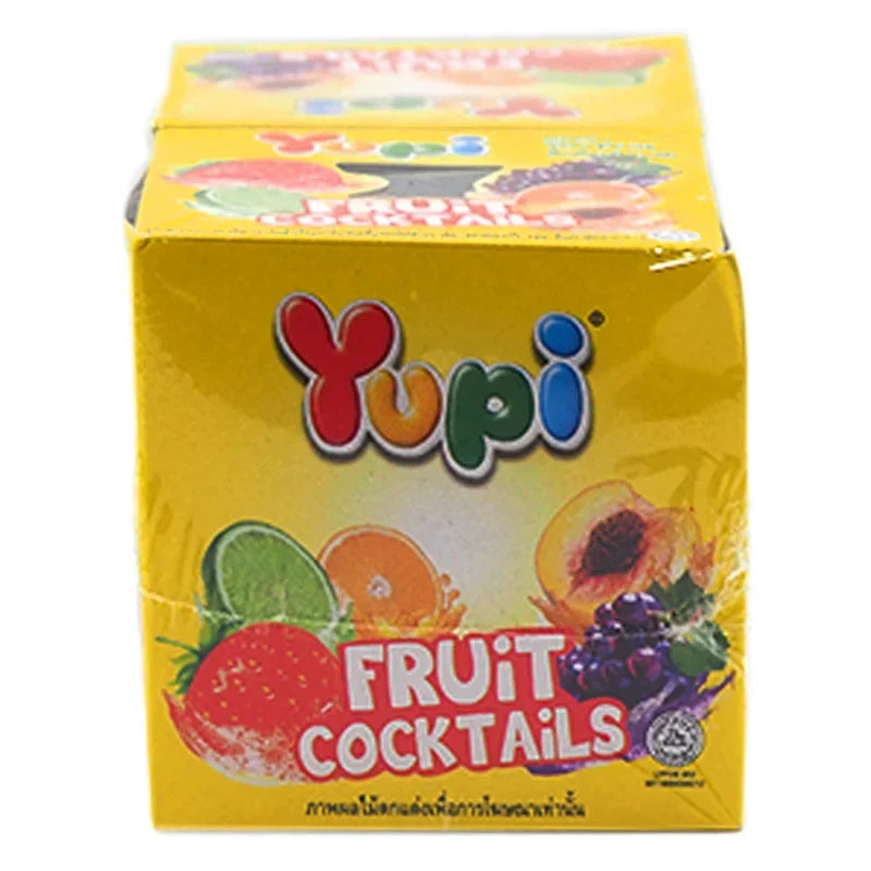 YUPI Yupi Fruit Cocktails snack, 14g individual packs, colorful chewy fruit candies in a clear bowl.