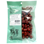 Im-Erb Chinese Dates drink in a clear glass, showcasing the rich dark color and smooth liquid inside.