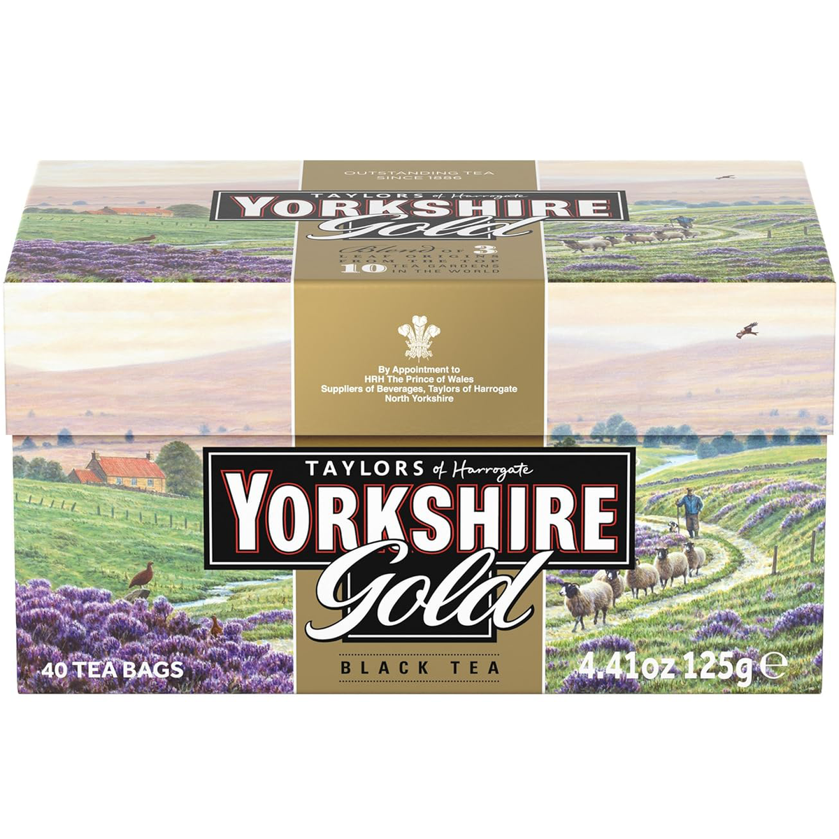 Taylors Yorkshire Gold Tea drink in a glass with a tea bag, showcasing the rich, golden color of the brewed tea.