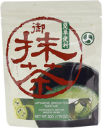 Makotoen Japanese green tea matcha drink in a clear glass, showcasing vibrant green tea color and frothy texture.