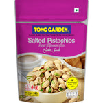 Tong Garden pistachio nuts in a clear bowl, showcasing the colorful, roasted confectionery snack with vibrant green pistachios.